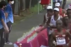 Marathon Olympian denies deliberately knocking over 'slippery' water bottles