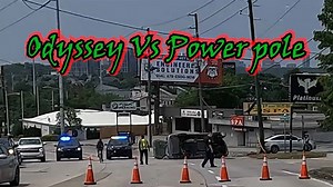 Flipped Car Entangled with Telephone Pole