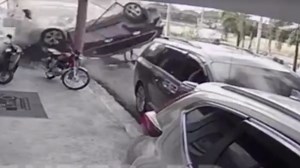 Vehicle Falls On A Man From A Second Floor Building