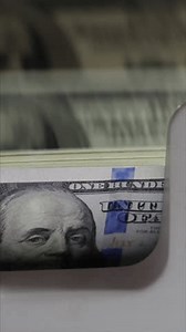 Close-Up Of Automatic Cash Counting Machine For 100 Dollar Bills. Machine Counting Hundred Dollar Banknotes. Vertical.