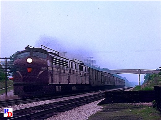 The "Spirit of St. Louis" passes by at Pocahontas, Indiana. This train began service on June 15, 1927. From the Green Frog Productions show "Pennsylvania Railroad, Film by Emery Gulash" https://rfd.video/PennsylvaniaRR | Classic Streamliners