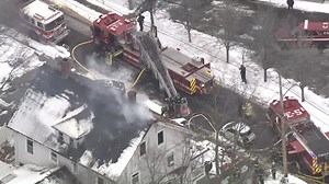 Firefighters fight 2-alarm house fire in Woburn, Massachusetts