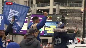Blue Bombers’ Andrew Harris celebrates during Grey Cup parade
