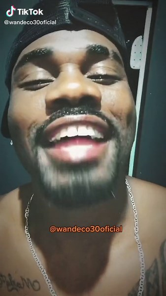 Cursive Tattoo Close-Up and Silver Necklace