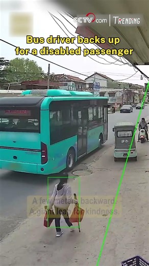 Bus driver backs up for a disabled passenger