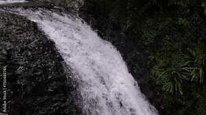 Close shot from the top of the waterfall on Cave Creek from the walking trail, Natural Bridge, Springbrook National Park.