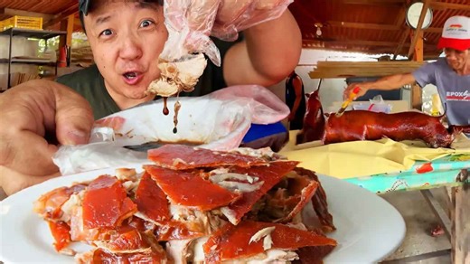 Pig slowly cooks as fat renders creating a golden crackling exterior