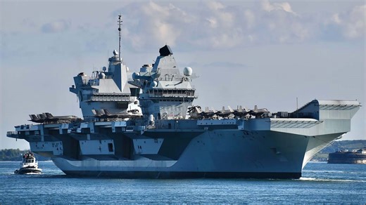 HMS Queen Elizabeth comes back into Portsmouth with a full air group onboard