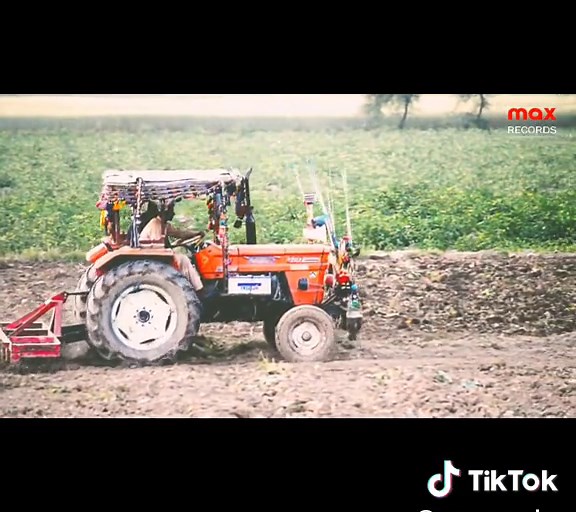 Max Tractor Plowing Field: Archival Footage