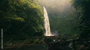 Beautiful waterfall in tropical rainforest jungle on nature background 4K