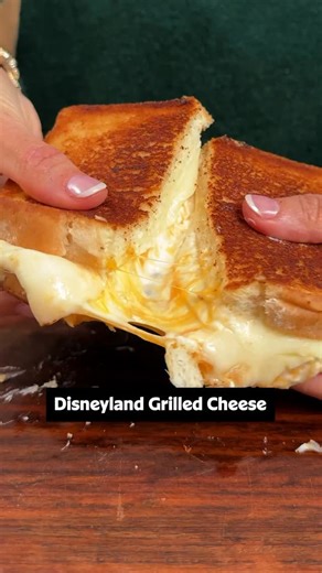 Just loooook at the cheese pull! 🤤🧀 For one of the best grilled cheese recipes you’ll ever try—straight from Disneyland—layer provolone and Cheddar slices with a Cheddar and cream cheese spread on hearty white bread. 🏰✨ Keep reading to get the full recipe or click the link in the @allrecipes bio! Ingredients: 4 ounces cream cheese, softened 2/3 cup shredded sharp Cheddar cheese 1 1/2 tablespoons heavy cream 1/2 teaspoon kosher salt, divided 1/2 cup mayonnaise 2 cloves garlic, finely minced 8 