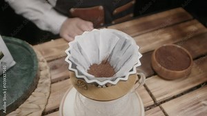 Adding coffee grounds to the container or funnel where water is poured is a traditional method, creating a rich brew as the water extracts the coffee's essence