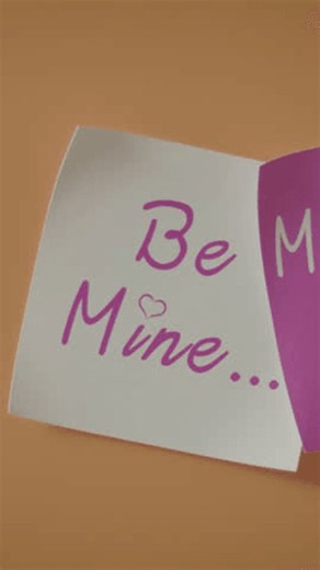 clip-4051942581-cozy-handwritten-note-reading-“be-mine”-rests