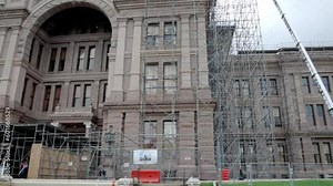 Construction out side the Texas state capitol building in Austin, Texas with close up pan left to right.
