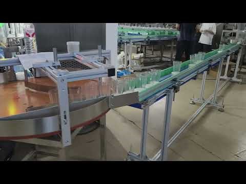 Automatic wick inserting machine for conical glass