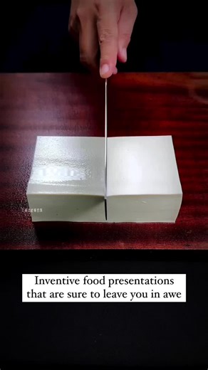 In the realm of culinary artistry, one remarkable creator redefines food presentation, turning it into a stunning form of expression. This artist masterfully transforms everyday ingredients like cheese and vegetables into mesmerizing creations. In a recent showcase, they intricately carved and arranged these elements to form a captivating book and a graceful butterfly. Every detail is meticulously crafted, reflecting the artist's exceptional skill and imagination. Their work bridges the gap betw
