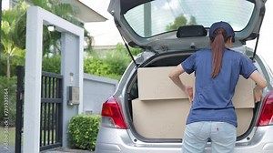 Asian female parcel delivery worker Delivering items to customers at home. Transportation and parcel delivery business