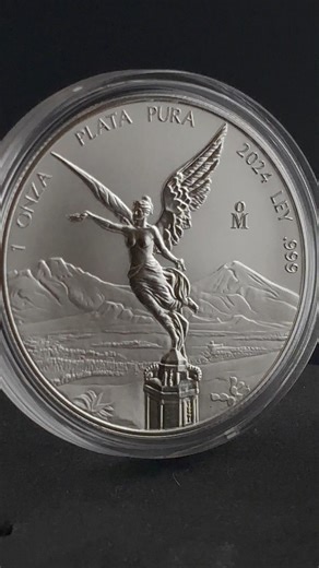 The 2024 1 oz Reverse Proof Mexican Silver Libertad showcases the iconic Winged Victory with dazzling mirror-like fields and frosted details, emphasizing every graceful element of its design. Struck by the Mexican Mint with .999 fine silver, this collector favorite blends beauty, history, and investment appeal in one striking piece. Limited mintage adds to its desirability among discerning silver enthusiasts. #SilverLibertad #MexicanMint #ReverseProof #BullionCollectibles #2024Libertad #Precious