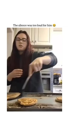 the laugh spot on Instagram: "This video is a short comedy sketch featuring a woman and an off-camera man. Here is a breakdown of what happens: Video Summary The Setup: A woman is shown flipping heart-shaped pancakes on a griddle while singing a parody of "Goodbye My Lover". The Action: After she finishes her song and clears the griddle, she reaches her hand out toward the hot surface. The Interruption: Just before she touches it, a man suddenly appears (or "spawns") into the frame, slaps her ha