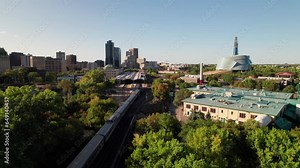 Cinematic aerial of Via Rail train entering Winnipeg, MB, 4K