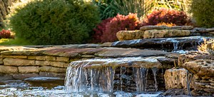 Landscaping Around Your Rock Waterfall | DoItYourself.com
