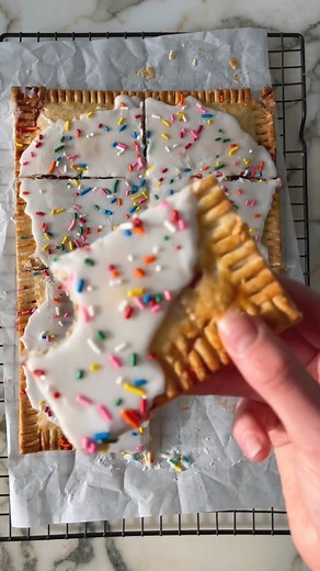 this giant pop tart is everything your inner kid wants. recipe: https://bromabakery.com/giant-frosted-strawberry-pop-tart/#search/q=strawberry ice | Broma Bakery