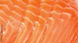 Indulge in the elegance of sashimi-grade salmon: exquisite slices boasting a radiant orange hue and gossamer-thin layers. Each cut whispers of unparalleled freshness and superior quality.