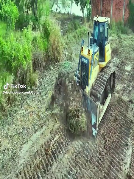 Dump Truck and Mini Dozer Working Together on Site