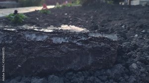 Explosion on the surface of the earth from an explosive device, hit by a shell or ammunition, the texture of smoke and flying soil from the shock wave in slow motion, the soil during combat Stock Video