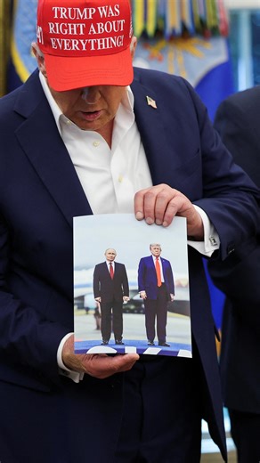 183K views · 8.3K reactions | During an announcement about the 2026 World Cup in the Oval Office, U.S. President Trump showed reporters a picture of himself and Vladimir Putin taken in Alaska during their summit, which he says was given to him by the Russian president. #donaldtrump #vladimirputin #usrussiatalks #ukraine #russiaukrainewar | Reuters | Facebook