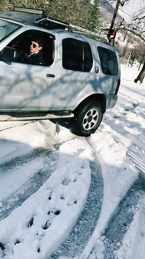 Silver SUV Stuck in Snowy Winter Road