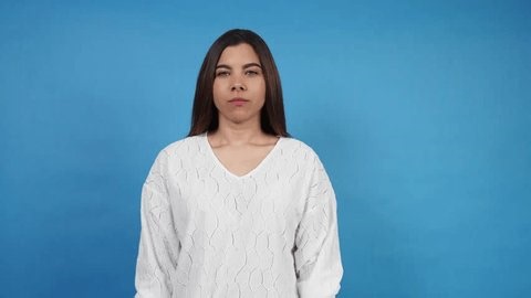 clip-4010322425-serious-young-brunette-woman-showing-rejection-gesture