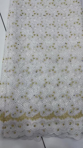 Intricate White Lace Fabric with Gold Embellishments