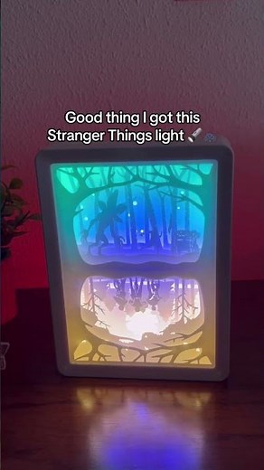 it's a premium **Stranger Things lamp** – a laser-cut, 3D LED Shadow Box! Handmade with paper