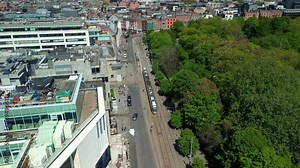 Aerial video of the Luas Tram System operating in Dublin City Centre, County Leinster, Ireland, on a bright and sunny day. Filmed in 4K next to St Stephen's Green, in 60FPS and with Rec709 color.