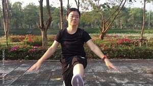 Asian female workout with cadio training at the park.