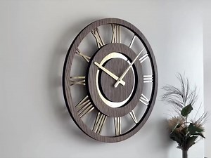Elevate your timekeeping with this elegant wooden wall clock, crafted from premium oak wood and featuring a golden acrylic mirror with a classic Roman numeral dial. A perfect blend of timeless design and modern sophistication. Dimensions Length : 16 inch Width : 16 inch Material Oak Wood, MDF and Golden Acrylic Mirror Color Walnut Matte Lacquer Finish Machine We Have Used High Quality Silent Quartz Movement. There Is No Tik Tok Sound in Our Wall Clock. 🌐https://aaafurniture.shop/products/unique