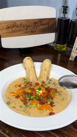 This Loaded Potato Cheddar Broccoli soup was too good! #Soupseason #Soup 🥣 Ingredient list 1 package bacon 1/2 yellow onion 1 bunch green scallion (white part for cooking, green for garnish) 4 cups chicken broth 1 pint half/half 6 lg russet potatoes 8 oz sharp cheddar ( more for topping) 2 broccoli crowns Lawrys total seasoning Black pepper | Eatingwithdani