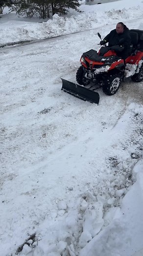 Snow Removal Using an ATV Plow in a Residential Area