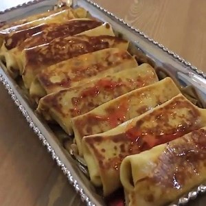 A good blintz tastes like heaven. Crispy on the outside and gooey on inside. This blintz recipe adds a Middle Eastern flare with a rosewater sauce and date filling. Full Recipe: http://bit.ly/SephardiBlintzes | Jewlish