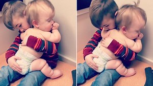 Sweet sibling moment: Brother rocks sick baby sister