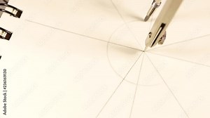 designer or engineer works with drawings using a compass