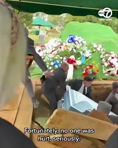 Story here 👉️ https://7ny.tv/3RGnI4z As they began to lay down the casket, video shows the platform above the burial site collapse and send the men plunging into the burial hole. | ABC7NY