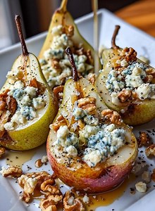 Elegant, simple, and irresistibly delicious — these Roasted Pears with Blue Cheese and Honey-Walnut Drizzle are a perfect balance of sweet, savory, and nutty flavors. The warm, caramelized pears pair beautifully with creamy blue cheese and crunchy walnuts, finished with a golden drizzle of honey for the ultimate gourmet bite. | Recipes by Sylvia