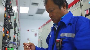 clip-1035989648-engineer-working-electricity-substation-building-check ...
