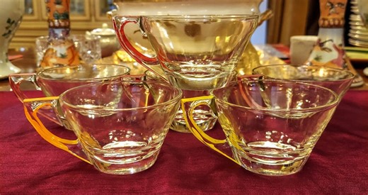 MCM Hazel Atlas clear glass multipurpose cups with multicolored handles.
