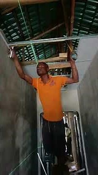 Drop ceiling installation with laser leveling machine #construction #dropceiling #suspendedceiling