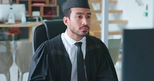 Computer, research or Muslim lawyer typing an email, contract or proposal letter for justice in a law firm. Islamic, internet or focused professional legal attorney networking online at office desk