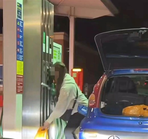 Woman filmed filling plastic bags with petrol