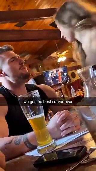 The night started innocently enough. We ordered a "hurricane" shot, expecting rum, passionfruit, and a little flair...Instead, the waitress grinned wickedly, knocked it back herself, then leaned in and spat the fiery mix straight into his open mouth. Before we could process it, she fished a lime wedge from her bra as the chaser, shoved it between his lips, and capped it off with a sharp slap across his face.Stunned silence. The whole place watched for a reaction that never came. Clearly, we had